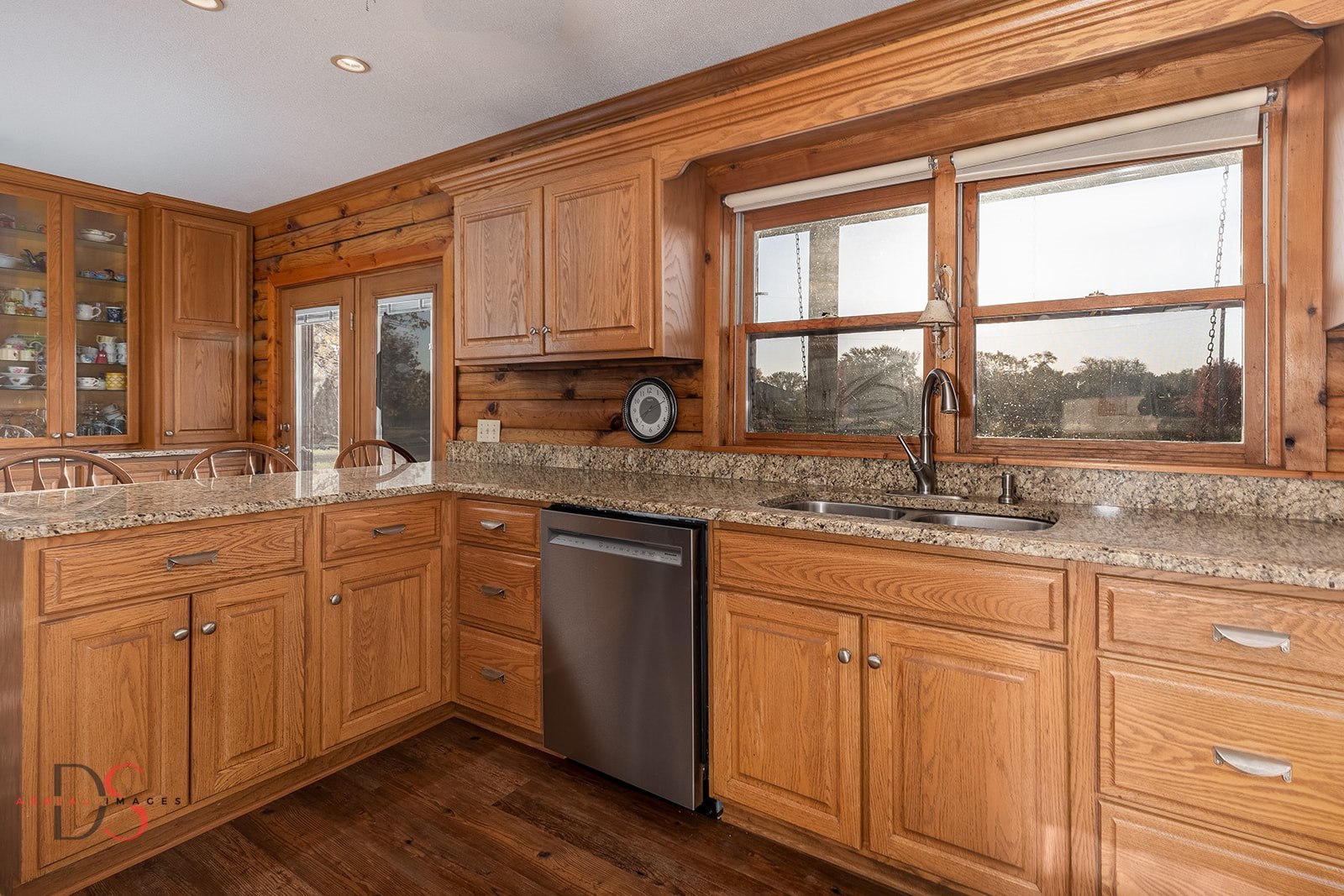 7920 Old Stage Road Morris, IL 60450 - Photo 15 of 43 a kitchen with granite countertop cabinets stainless steel appliances a sink and a large window