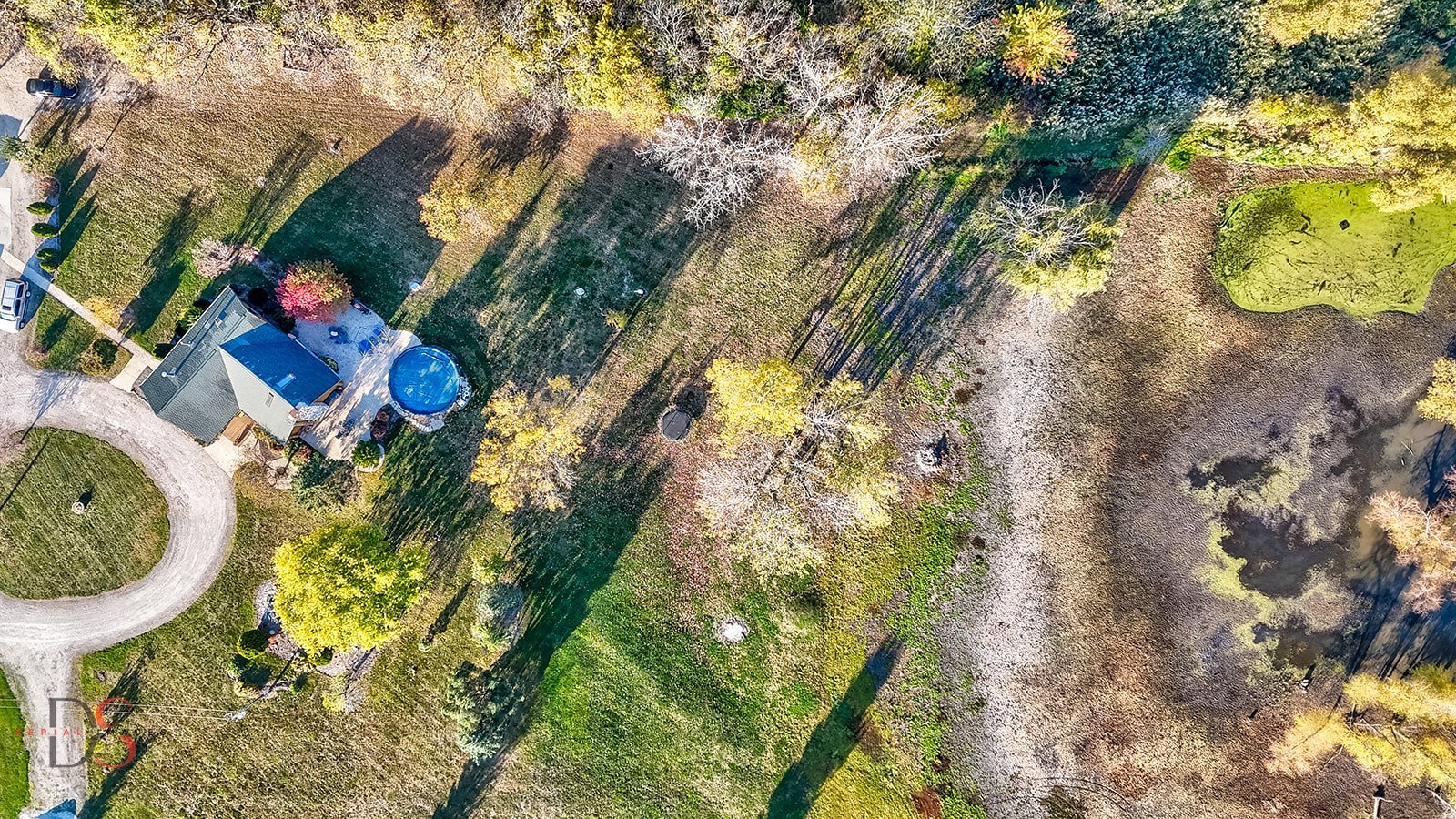 7920 Old Stage Road Morris, IL 60450 - Photo 40 of 43 a aerial view of a house with swimming pool and large trees