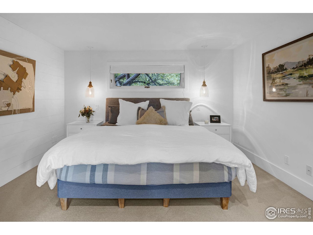 3858 57th Street Boulder, CO 80301 - Photo 11 of 39 a large bed sitting in a bedroom next to a window