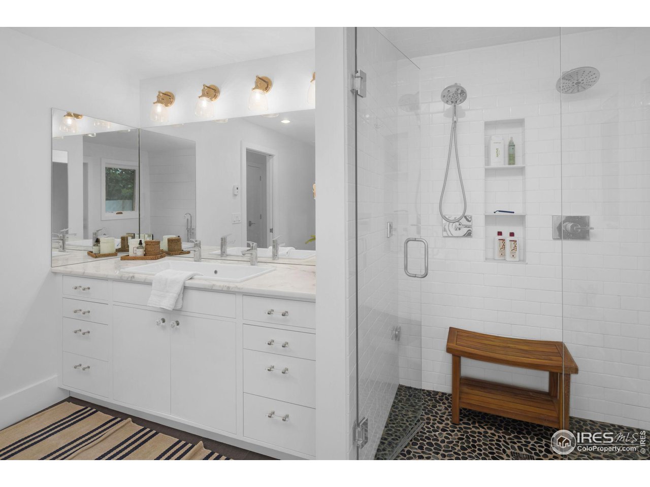 3858 57th Street Boulder, CO 80301 - Photo 15 of 39 a bathroom with a sink a light fixture and a toilet