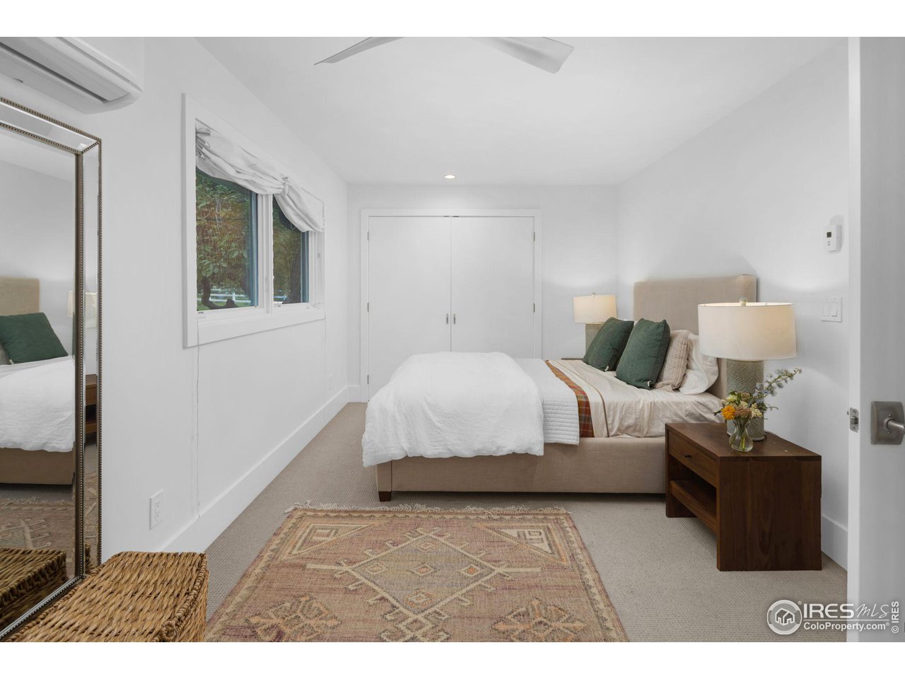3858 57th Street Boulder, CO 80301 - Photo 19 of 39 a spacious bedroom with a bed and a night stand