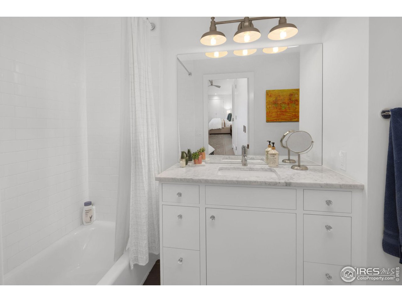 3858 57th Street Boulder, CO 80301 - Photo 20 of 39 a bathroom with a sink and a mirror