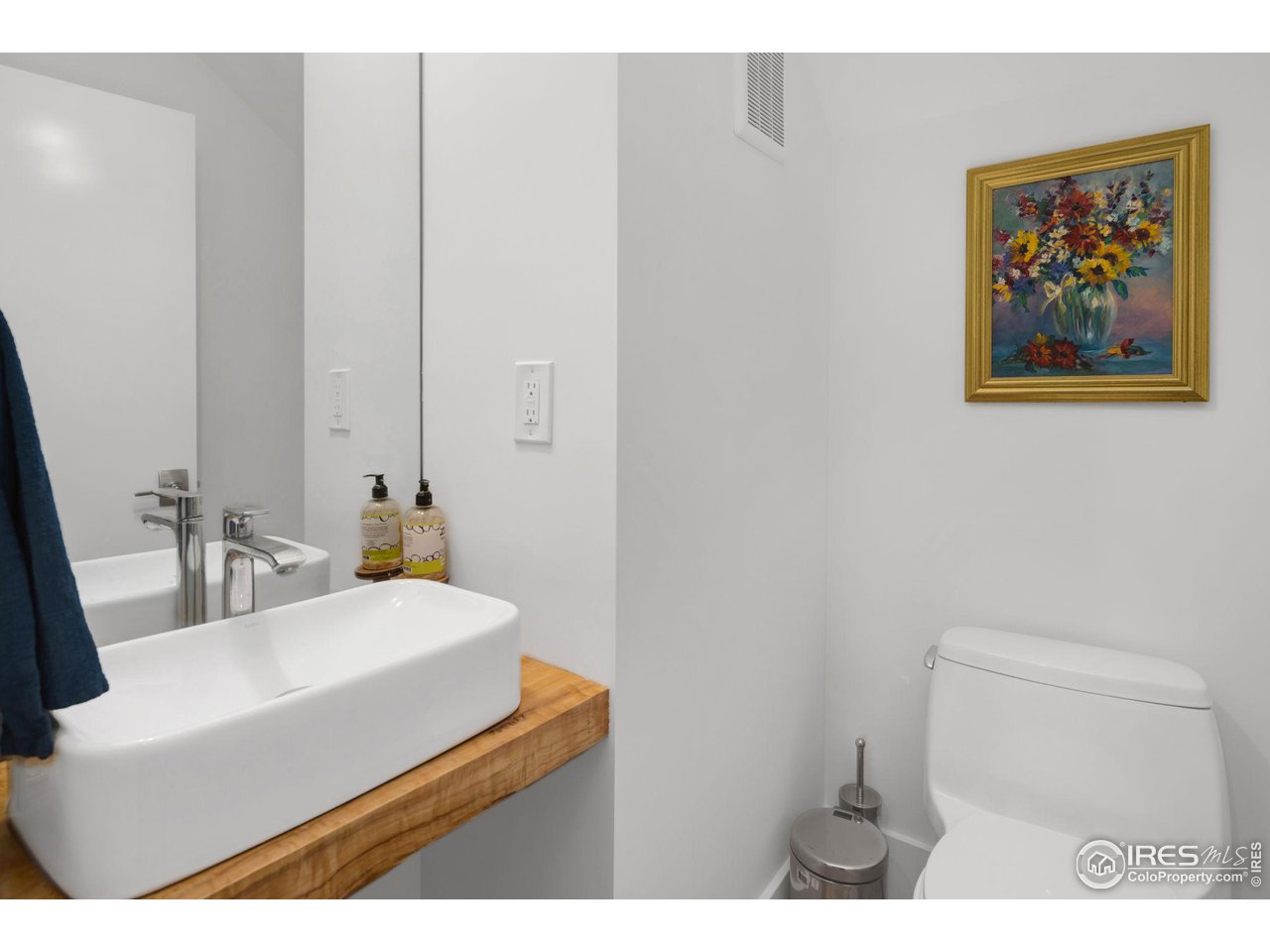 3858 57th Street Boulder, CO 80301 - Photo 27 of 39 a bathroom with a sink a toilet and mirror