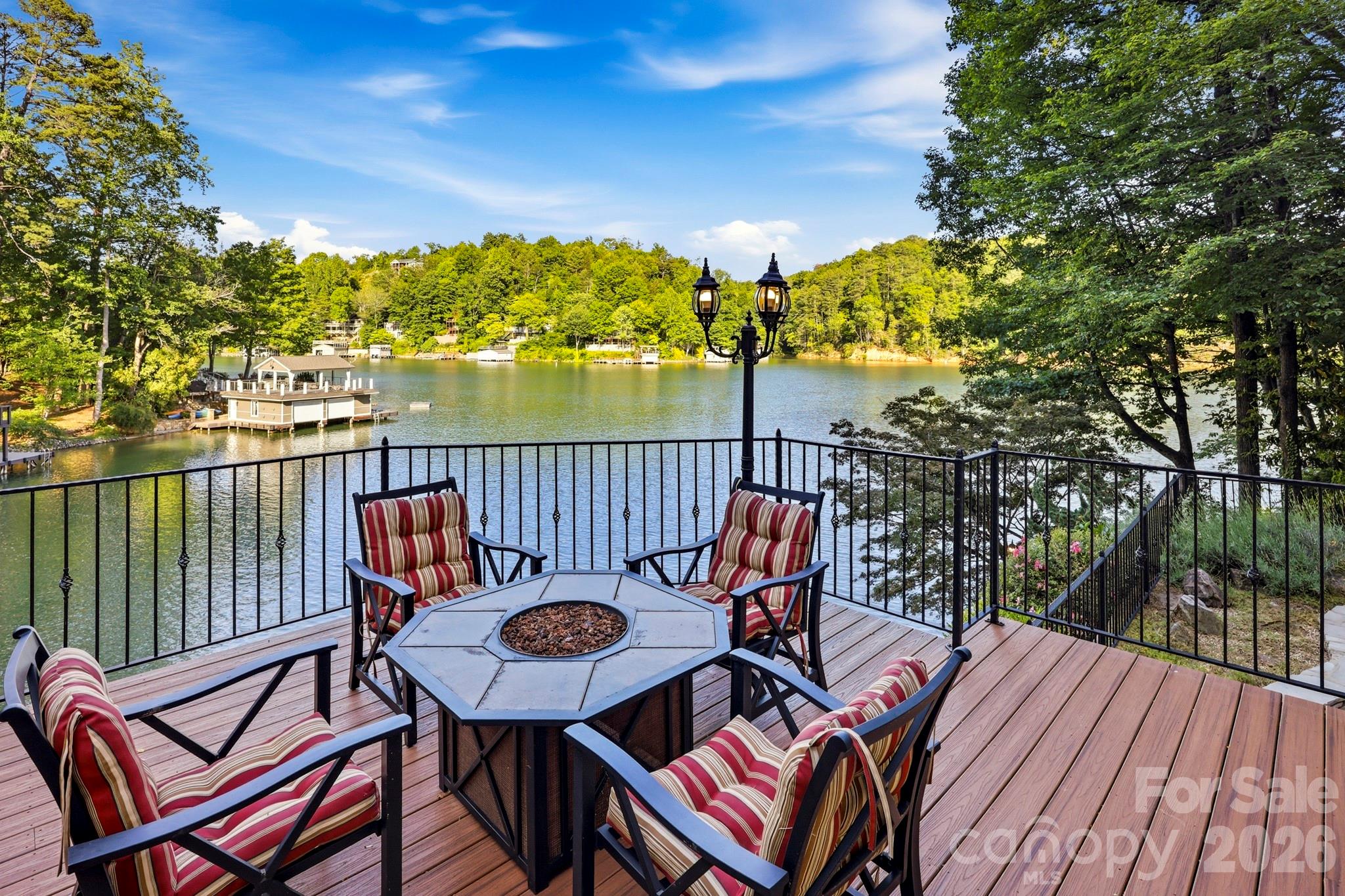 151 Garner Road Lake Lure, NC 28746 - Photo 33 of 48 a view of a chairs and table on the wooden deck