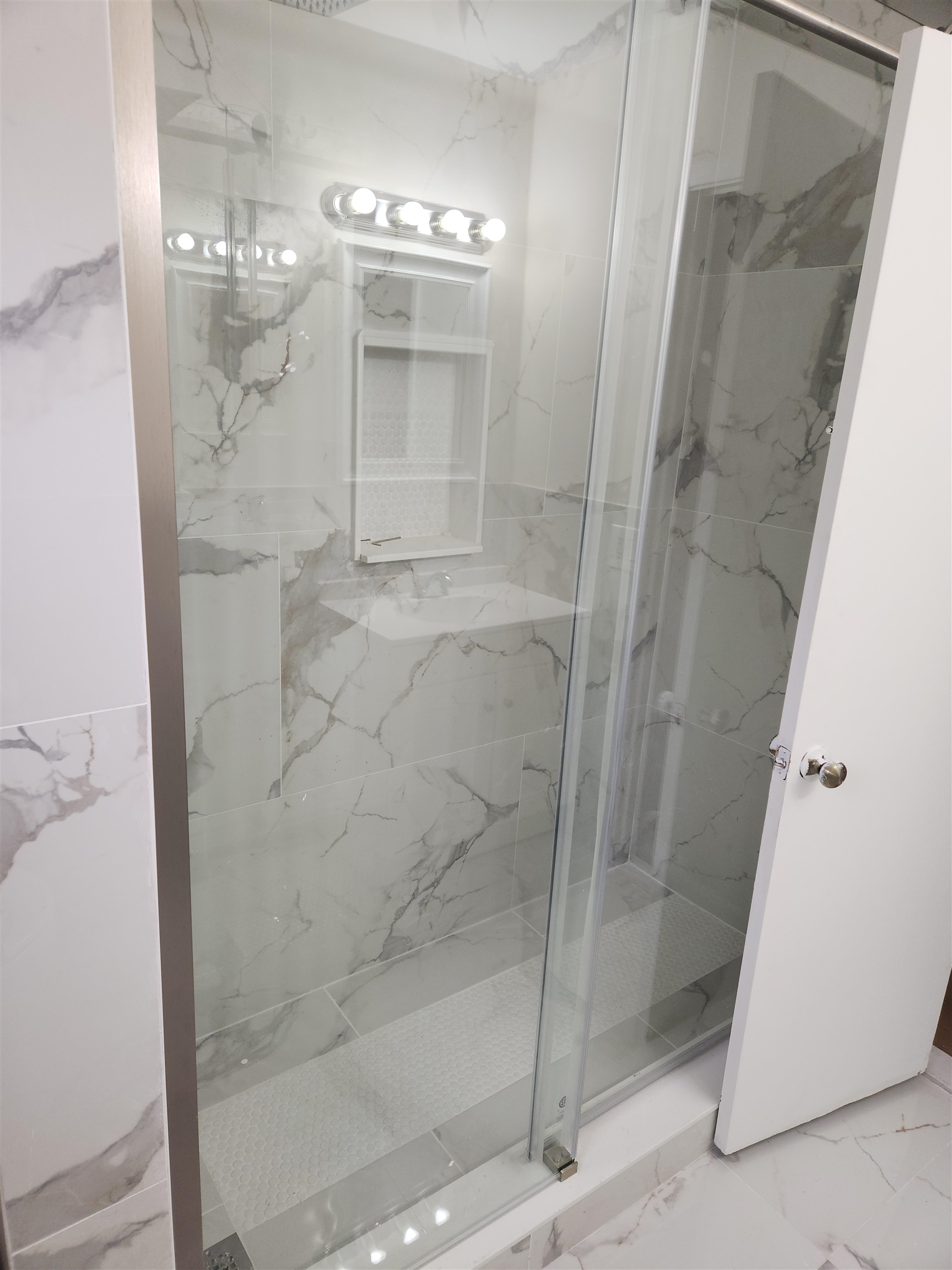 71 Linnet Street, Unit 2 Bayonne, NJ 07002 - Photo 12 of 18 a bathroom with a glass shower door