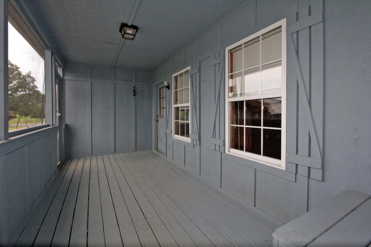 4845 Starks Road Cross Plains, TN 37049 - Photo 16 of 27 a view of wooden floor and windows in a room