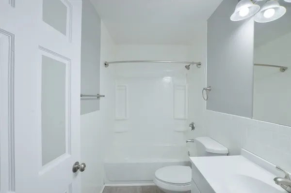 a bathroom with a toilet and shower