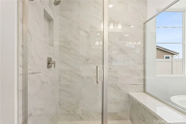 a bathroom with a shower and a toilet