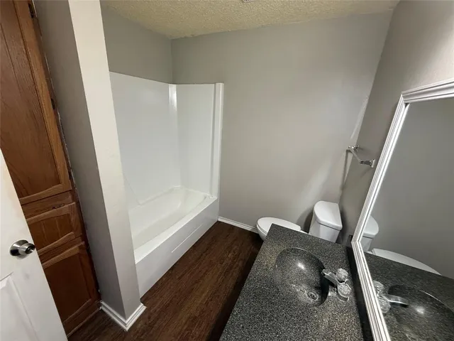 a view of utility room with wooden floor