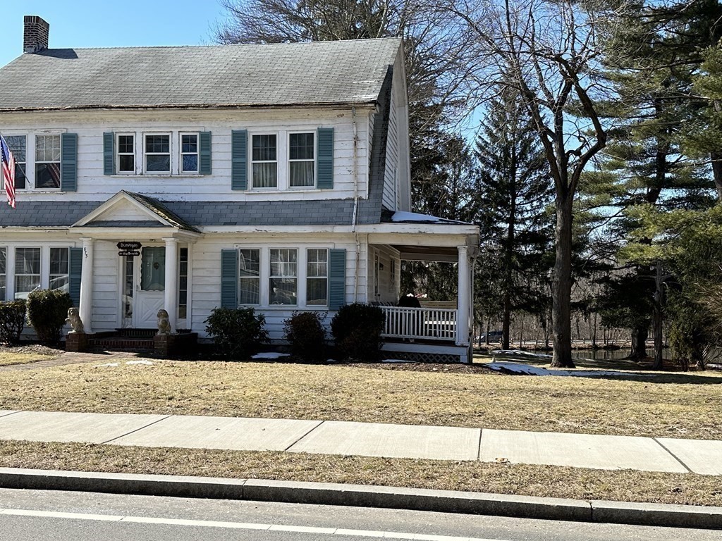 873 Chestnut Street Newton, MA 02468 - Photo 2 of 7 a front view of a house with a yard