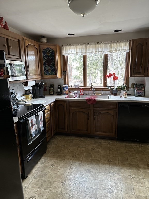 873 Chestnut Street Newton, MA 02468 - Photo 5 of 7 a kitchen with a sink stove and cabinets