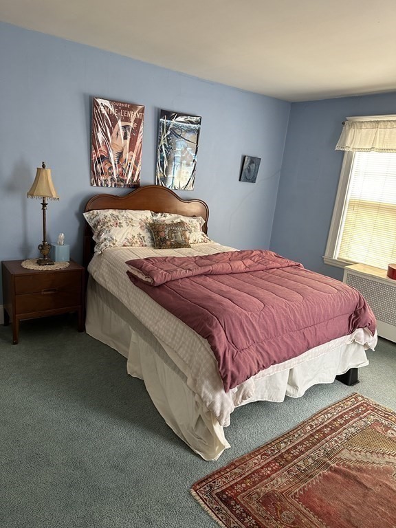 873 Chestnut Street Newton, MA 02468 - Photo 6 of 7 a bedroom with a bed and painting on the wall