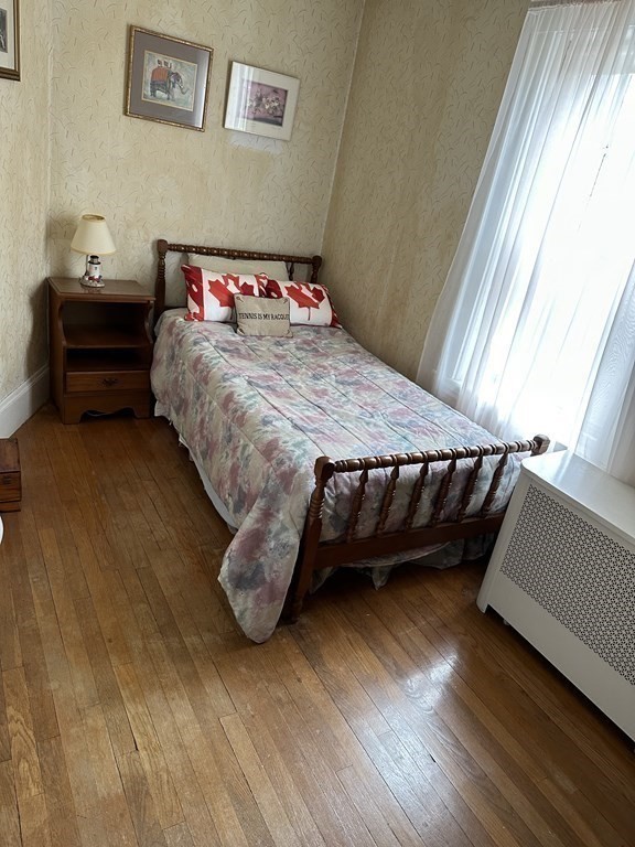 873 Chestnut Street Newton, MA 02468 - Photo 7 of 7 a bedroom with a bed and a window