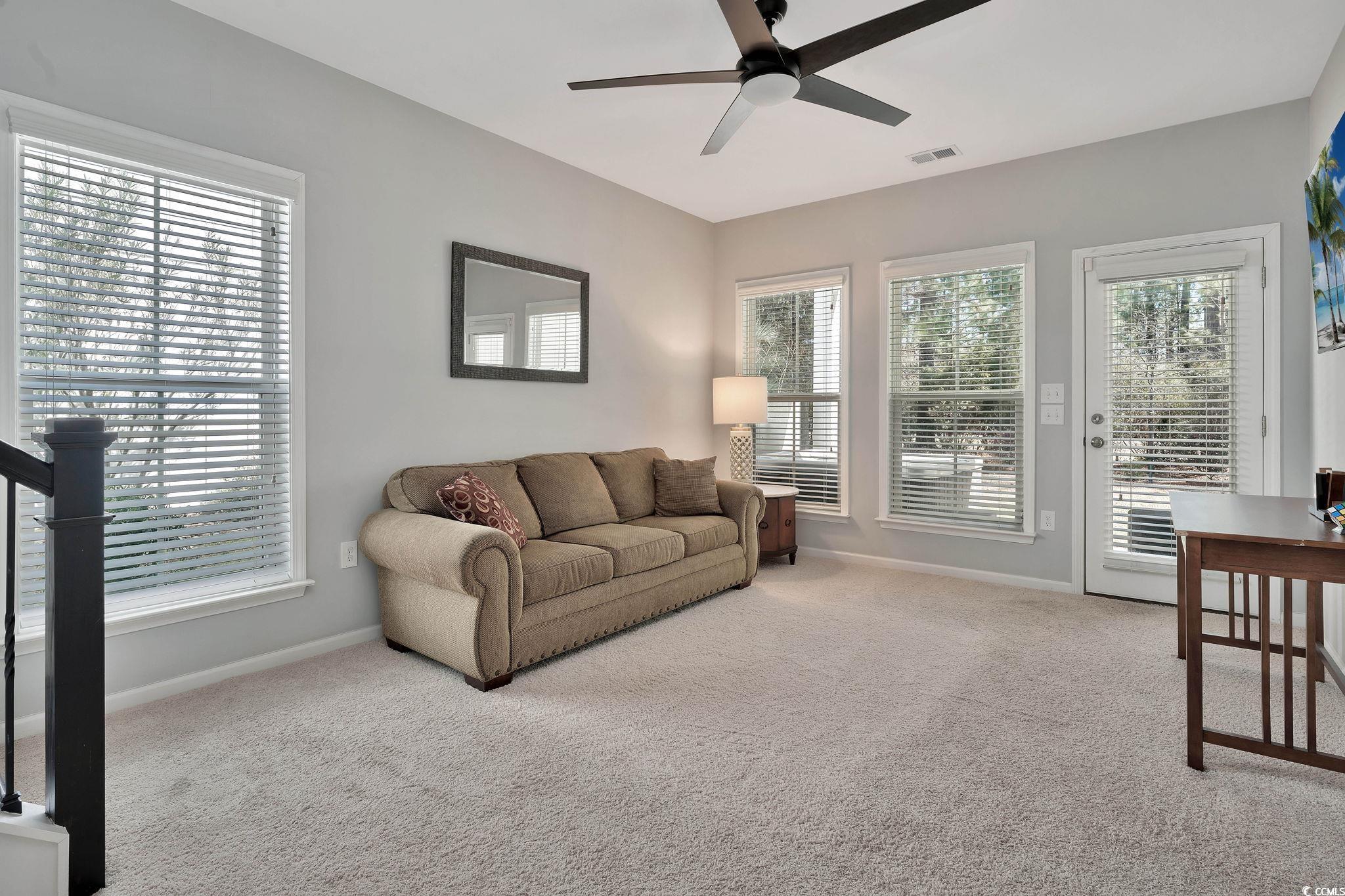 141 Splendor Circle Murrells Inlet, SC 29576 - Photo 5 of 34 Living area with carpet floors, a wealth of natura