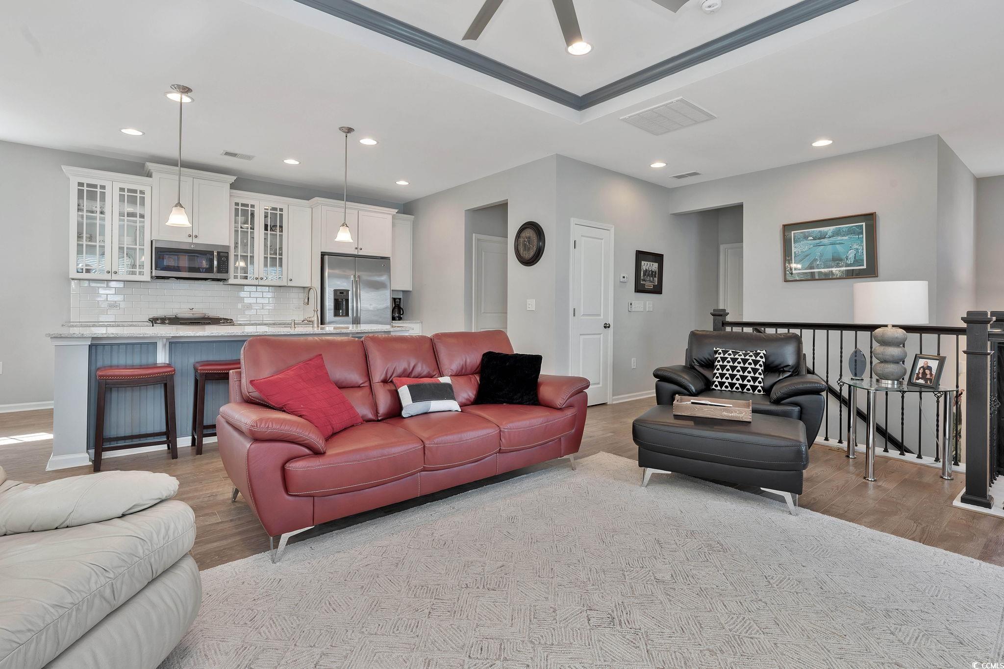 141 Splendor Circle Murrells Inlet, SC 29576 - Photo 8 of 34 Living area with visible vents, wood finished floo