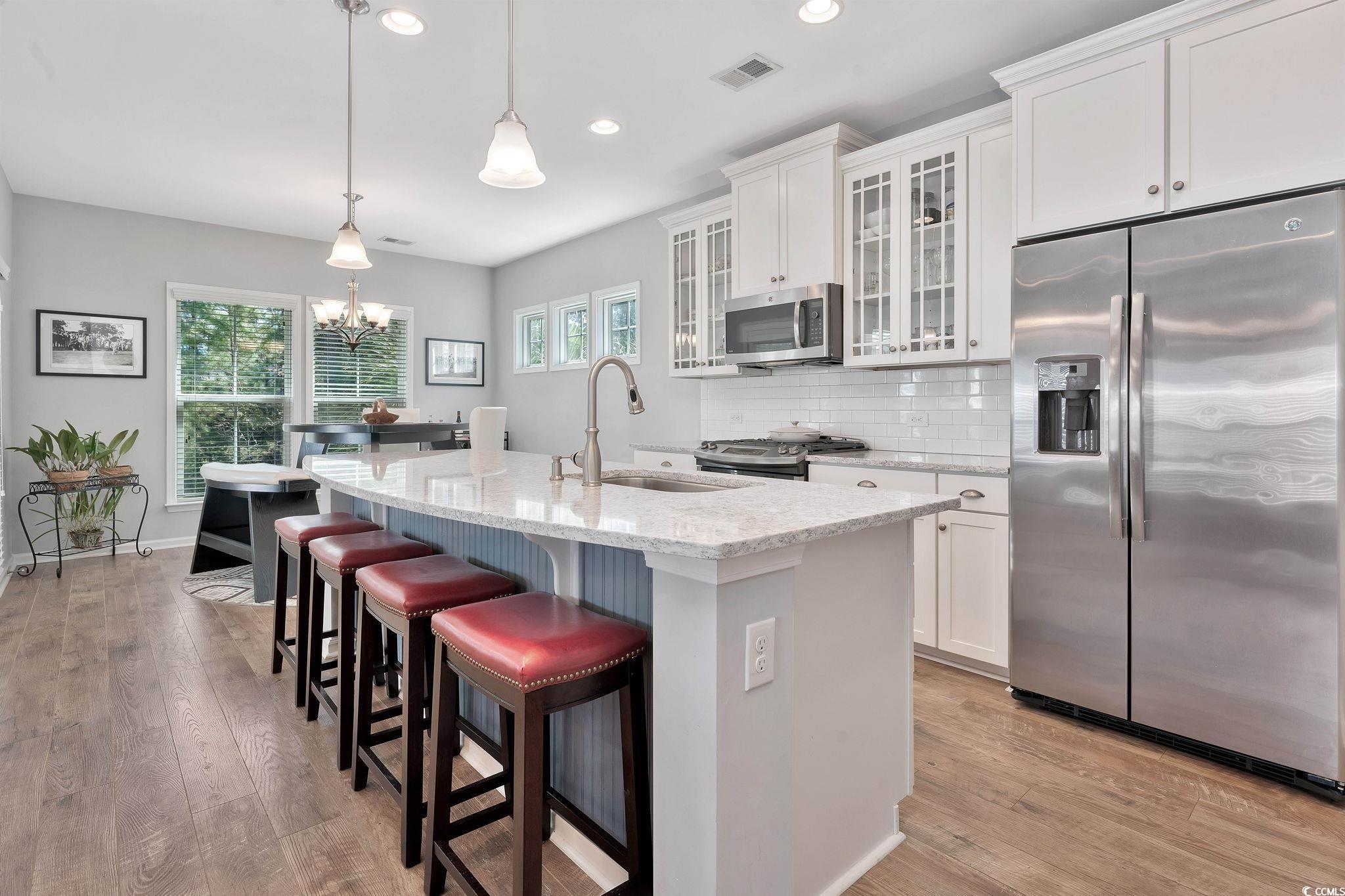 141 Splendor Circle Murrells Inlet, SC 29576 - Photo 9 of 34 Kitchen with a sink, white cabinetry, appliances w