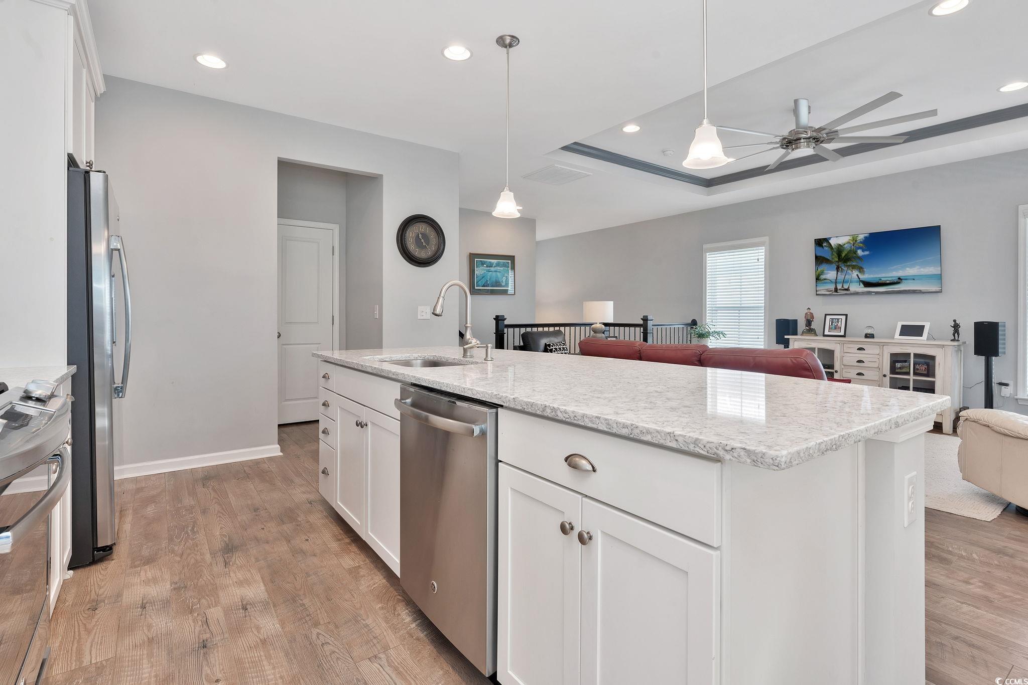 141 Splendor Circle Murrells Inlet, SC 29576 - Photo 10 of 34 Kitchen with stainless steel appliances, light woo
