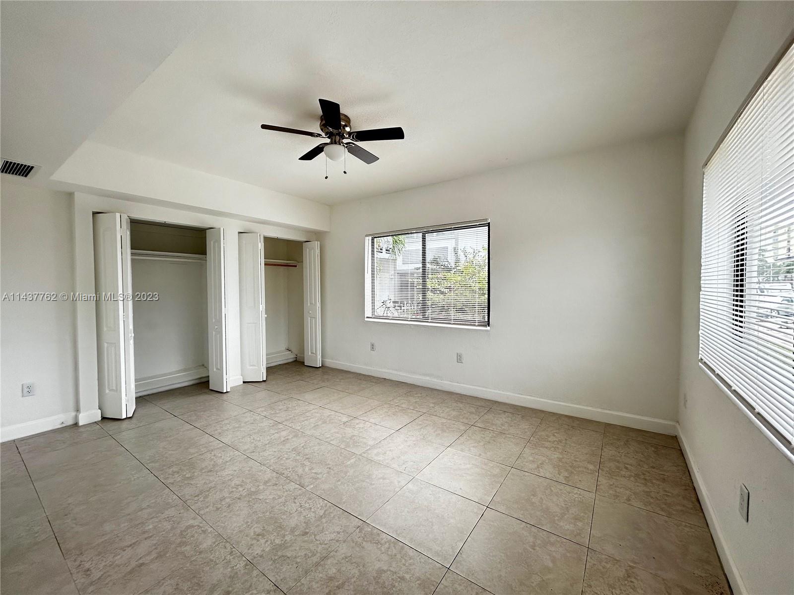 875 80th Street, Unit 3 Miami Beach, FL 33141 - Photo 6 of 15 a view of an empty room with a window