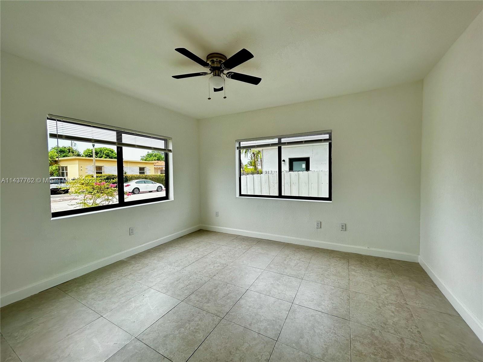 875 80th Street, Unit 3 Miami Beach, FL 33141 - Photo 8 of 15 a view of an empty room with a window