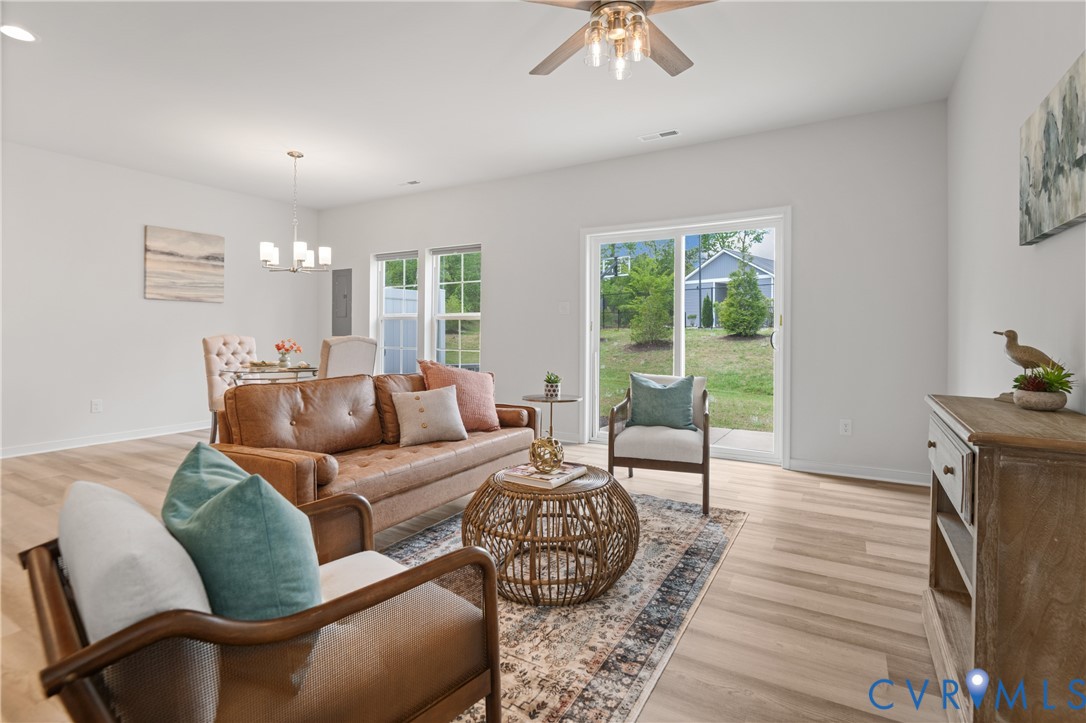 11348 Benton Pointe Way Chester, VA 23831 - Photo 13 of 45 a living room with furniture and a large window
