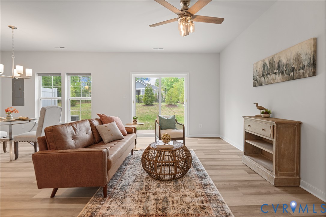 11348 Benton Pointe Way Chester, VA 23831 - Photo 14 of 45 a living room with furniture and a large window