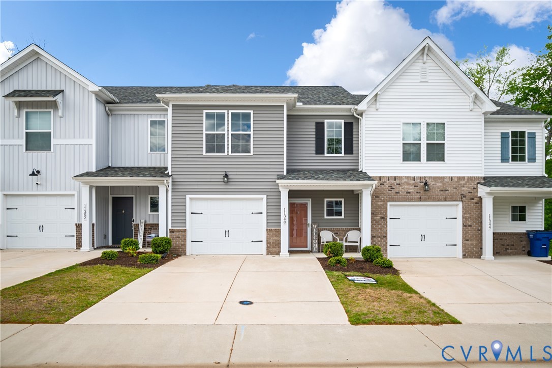11348 Benton Pointe Way Chester, VA 23831 - Photo 2 of 45 a front view of a house with a yard and garage