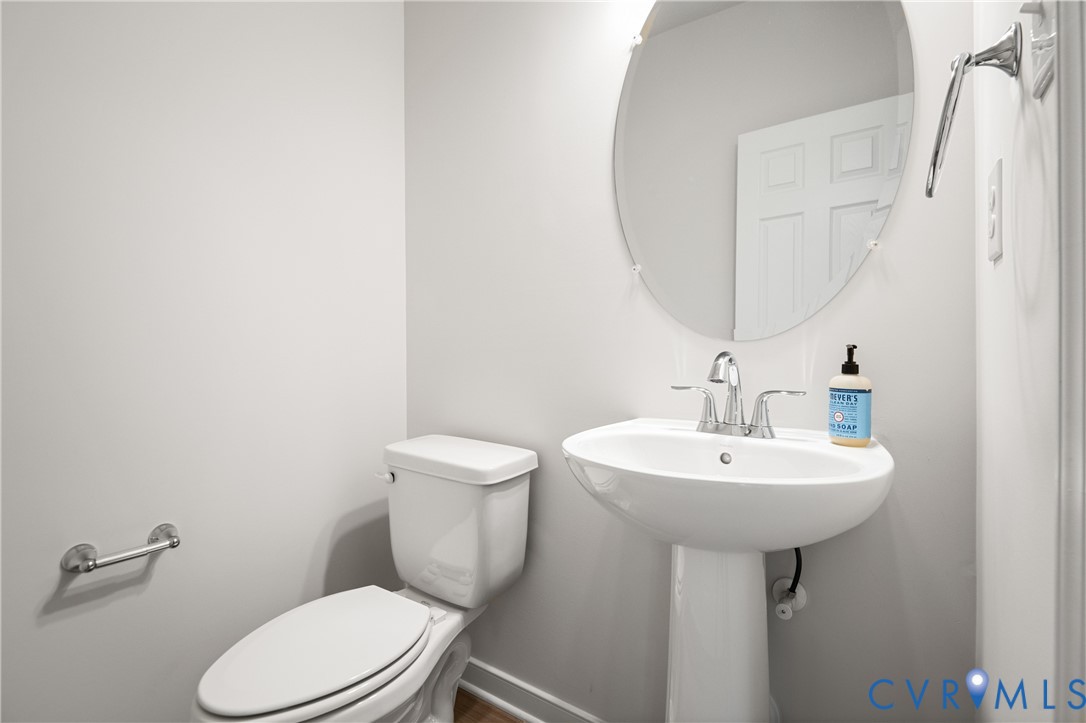 11348 Benton Pointe Way Chester, VA 23831 - Photo 23 of 45 a bathroom with a sink a toilet and mirror
