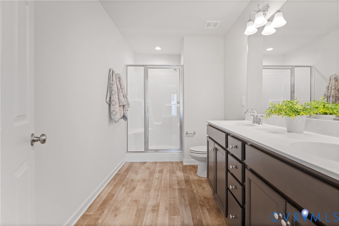 11348 Benton Pointe Way Chester, VA 23831 - Photo 29 of 45 a bathroom with a sink and a mirror