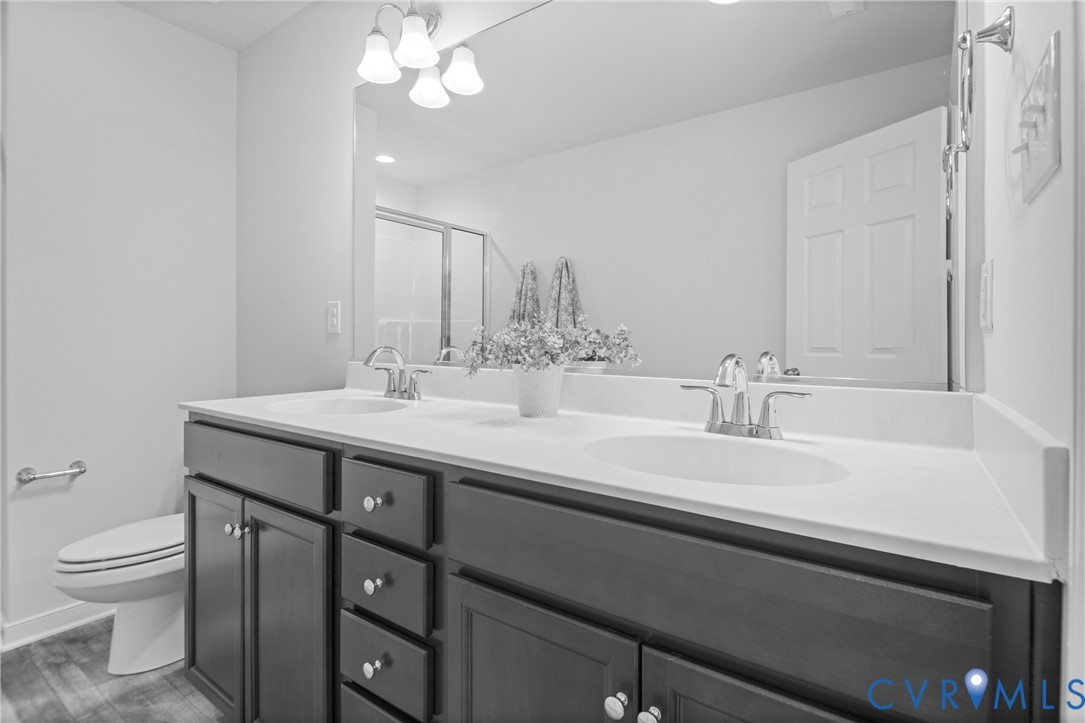11348 Benton Pointe Way Chester, VA 23831 - Photo 30 of 45 a bathroom with a sink a toilet and a mirror