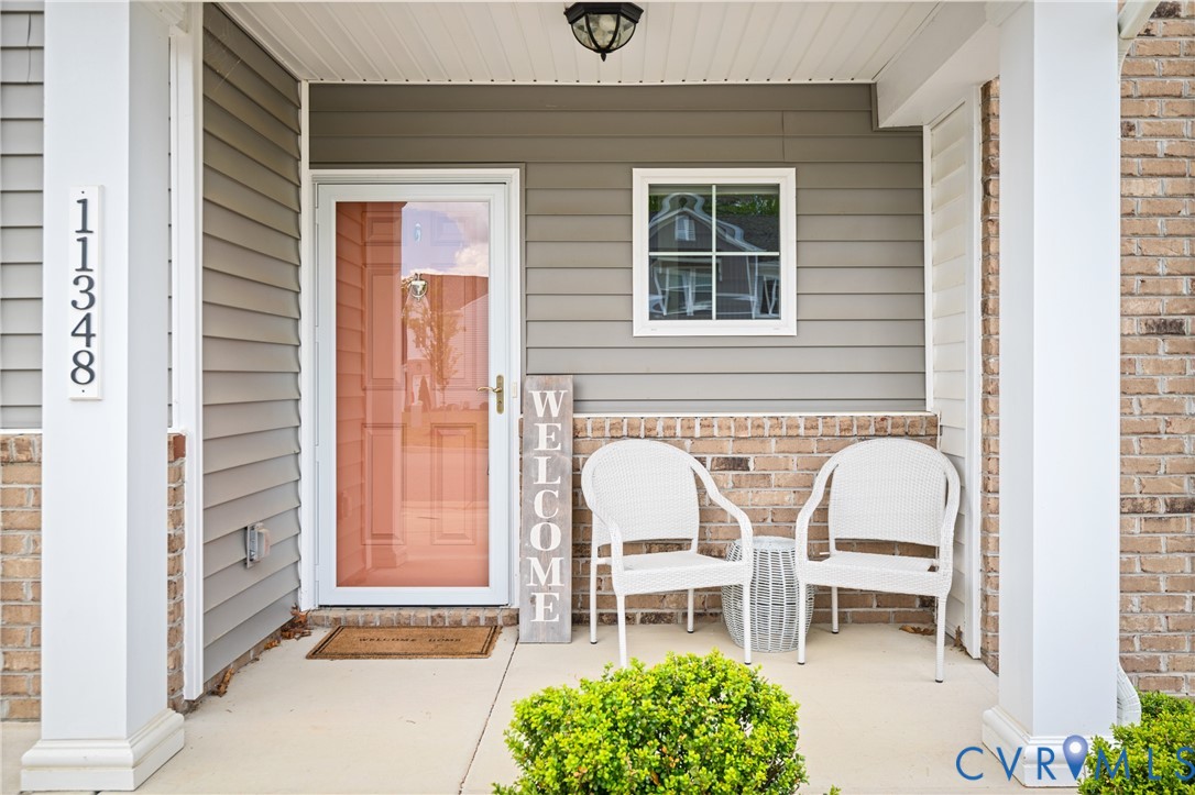 11348 Benton Pointe Way Chester, VA 23831 - Photo 3 of 45 a view of house with chairs and a table and chair