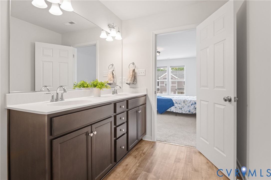 11348 Benton Pointe Way Chester, VA 23831 - Photo 31 of 45 a bathroom with a sink double vanity and a mirror