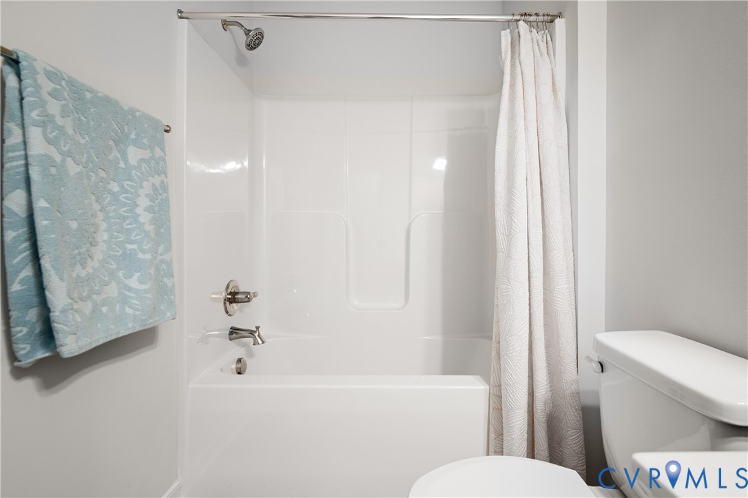 11348 Benton Pointe Way Chester, VA 23831 - Photo 39 of 45 a white toilet sitting next to a bath tub