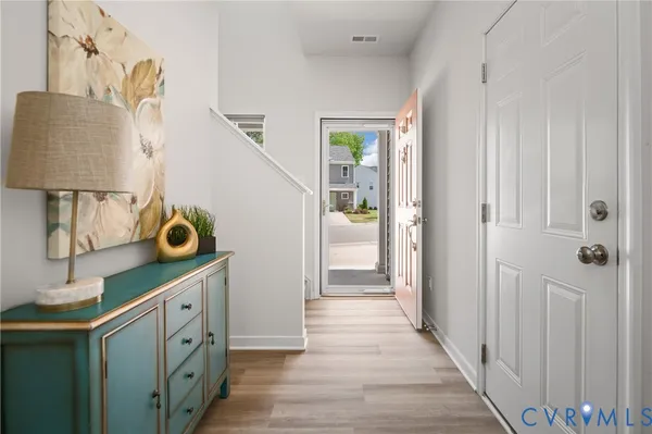 a hallway view with wooden floor