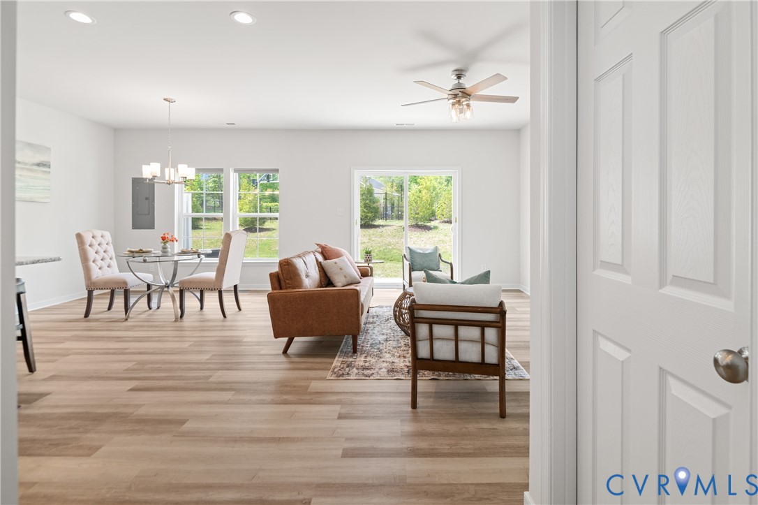 11348 Benton Pointe Way Chester, VA 23831 - Photo 7 of 45 a living room with furniture and a wooden floor