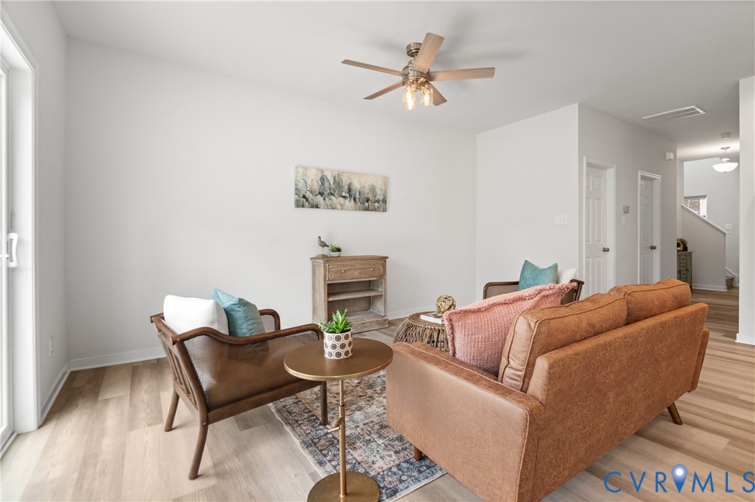 11348 Benton Pointe Way Chester, VA 23831 - Photo 10 of 45 a living room with furniture and a wooden floor