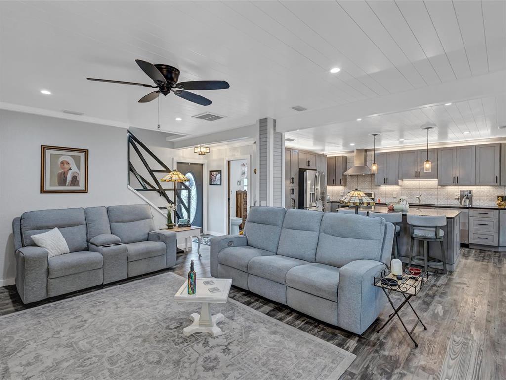7581 Cumberland Road, Unit 7 Seminole, FL 33777 - Photo 12 of 68 a living room with furniture and a view of kitchen