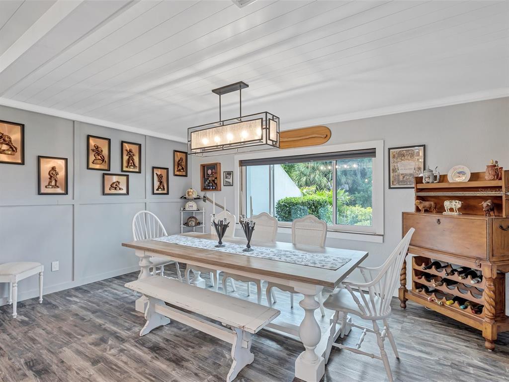 7581 Cumberland Road, Unit 7 Seminole, FL 33777 - Photo 20 of 68 a view of a dining room with furniture window and wooden floor