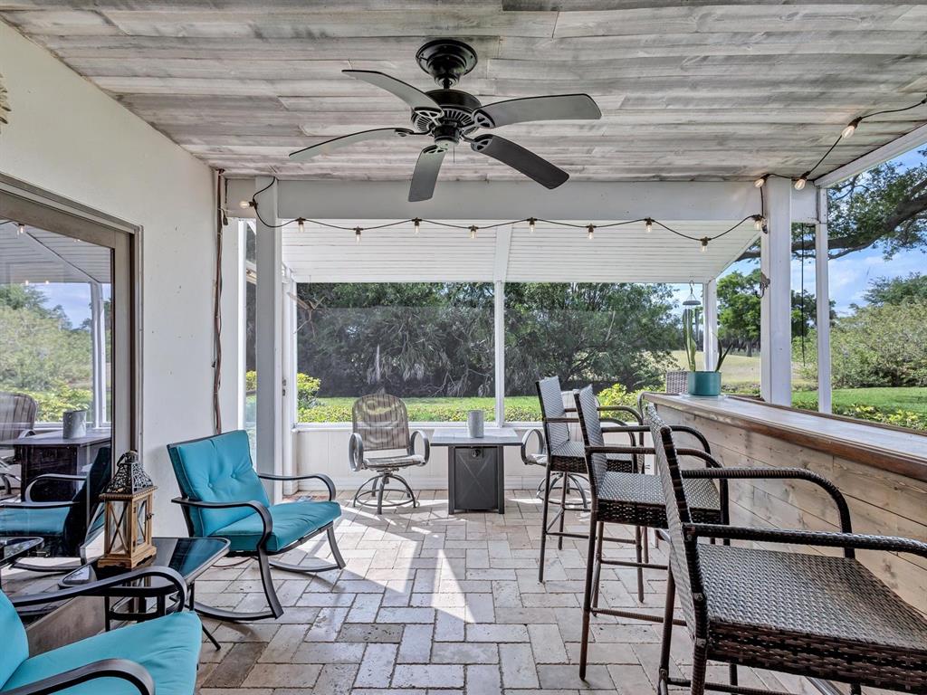 7581 Cumberland Road, Unit 7 Seminole, FL 33777 - Photo 26 of 68 a view of a patio with a table and chairs