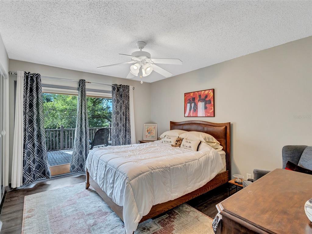 7581 Cumberland Road, Unit 7 Seminole, FL 33777 - Photo 27 of 68 a bedroom with two beds and a large window