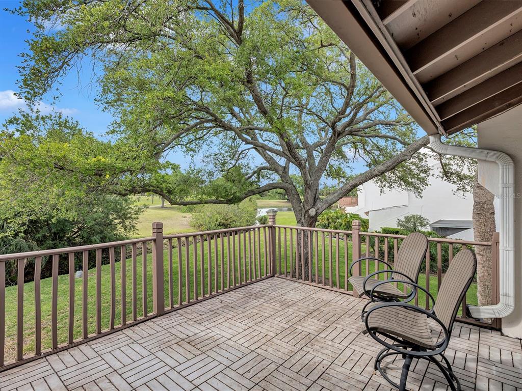 7581 Cumberland Road, Unit 7 Seminole, FL 33777 - Photo 29 of 68 a view of a two chairs on the roof deck