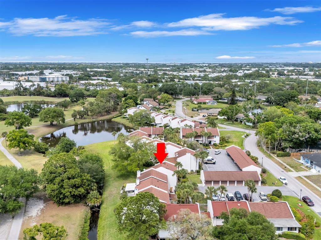 7581 Cumberland Road, Unit 7 Seminole, FL 33777 - Photo 45 of 68 an aerial view of residential houses with outdoor space and ocean view