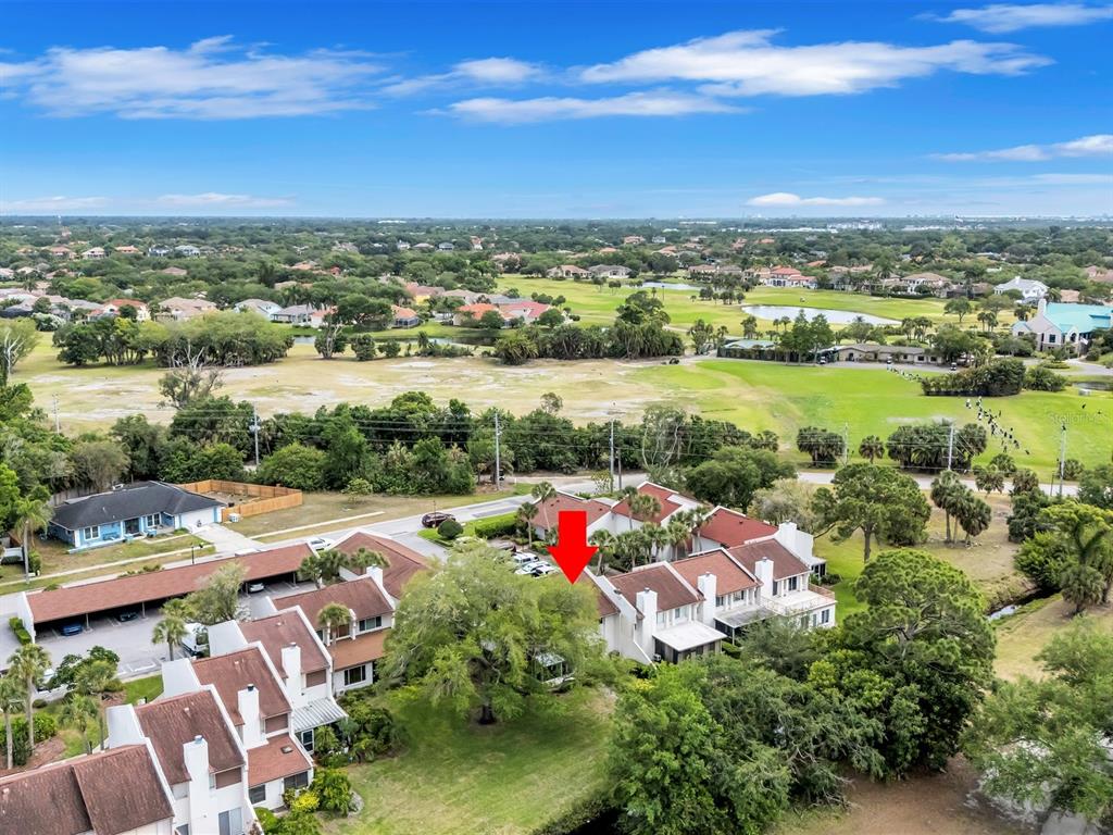 7581 Cumberland Road, Unit 7 Seminole, FL 33777 - Photo 48 of 68 an aerial view of residential houses with outdoor space and lake view