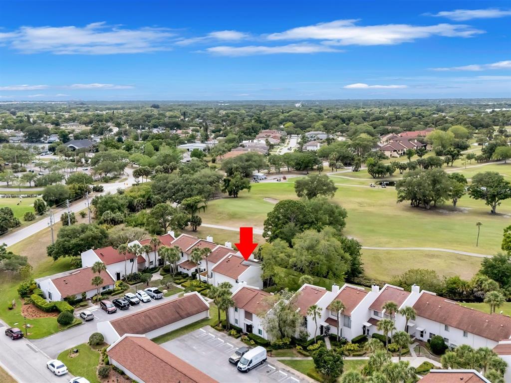 7581 Cumberland Road, Unit 7 Seminole, FL 33777 - Photo 50 of 68 an aerial view of residential houses with outdoor space and ocean view