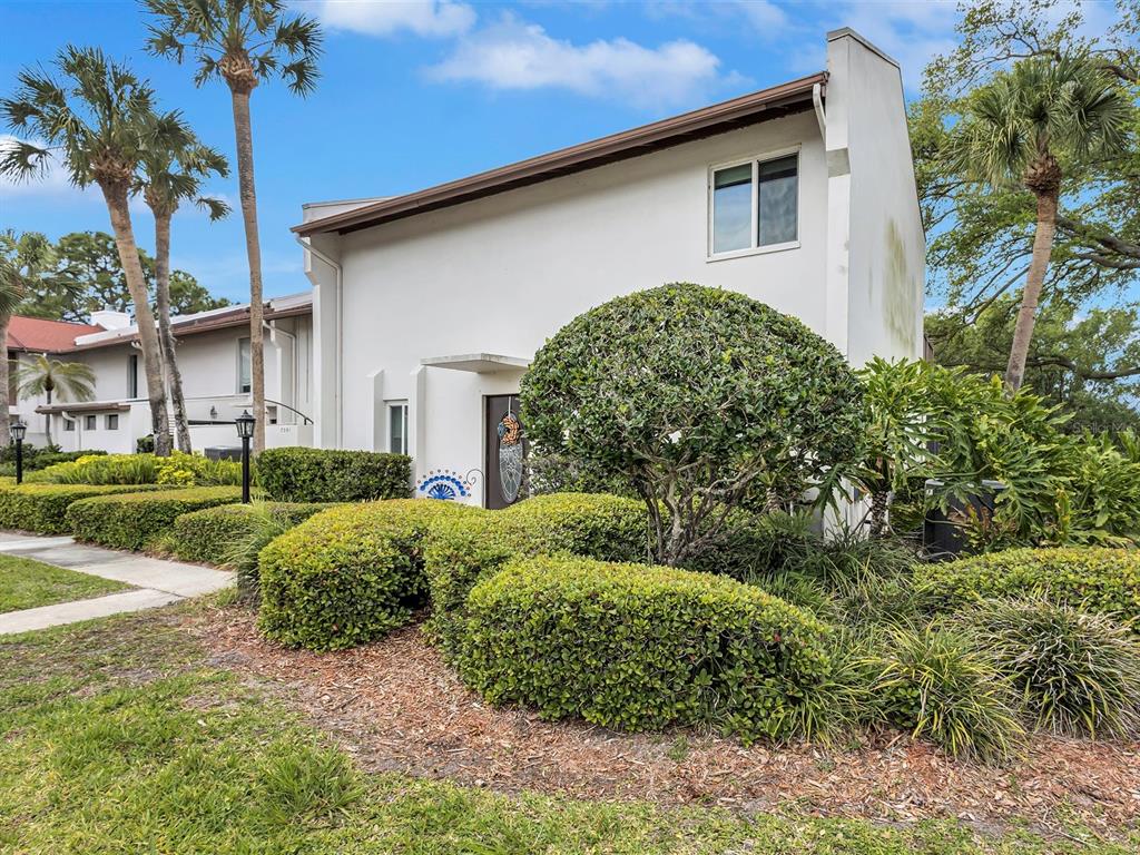 7581 Cumberland Road, Unit 7 Seminole, FL 33777 - Photo 54 of 68 a house view with a garden space