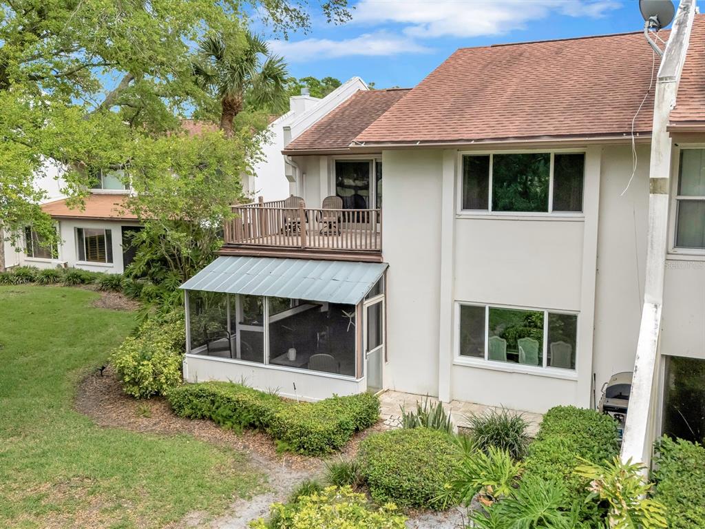 7581 Cumberland Road, Unit 7 Seminole, FL 33777 - Photo 57 of 68 a front view of a house with a yard