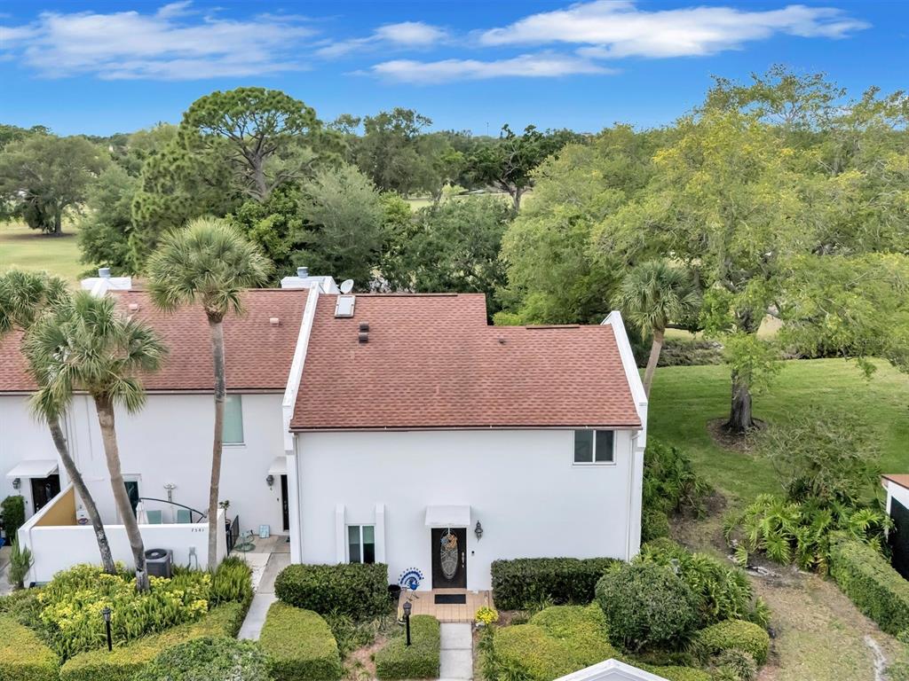 7581 Cumberland Road, Unit 7 Seminole, FL 33777 - Photo 65 of 68 an aerial view of a house with a yard basket ball court and outdoor seating