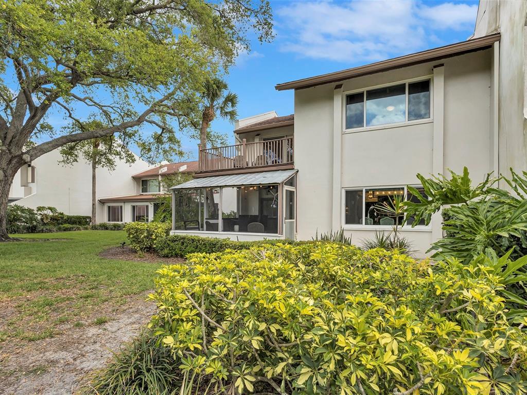 7581 Cumberland Road, Unit 7 Seminole, FL 33777 - Photo 67 of 68 a front view of a house with a yard