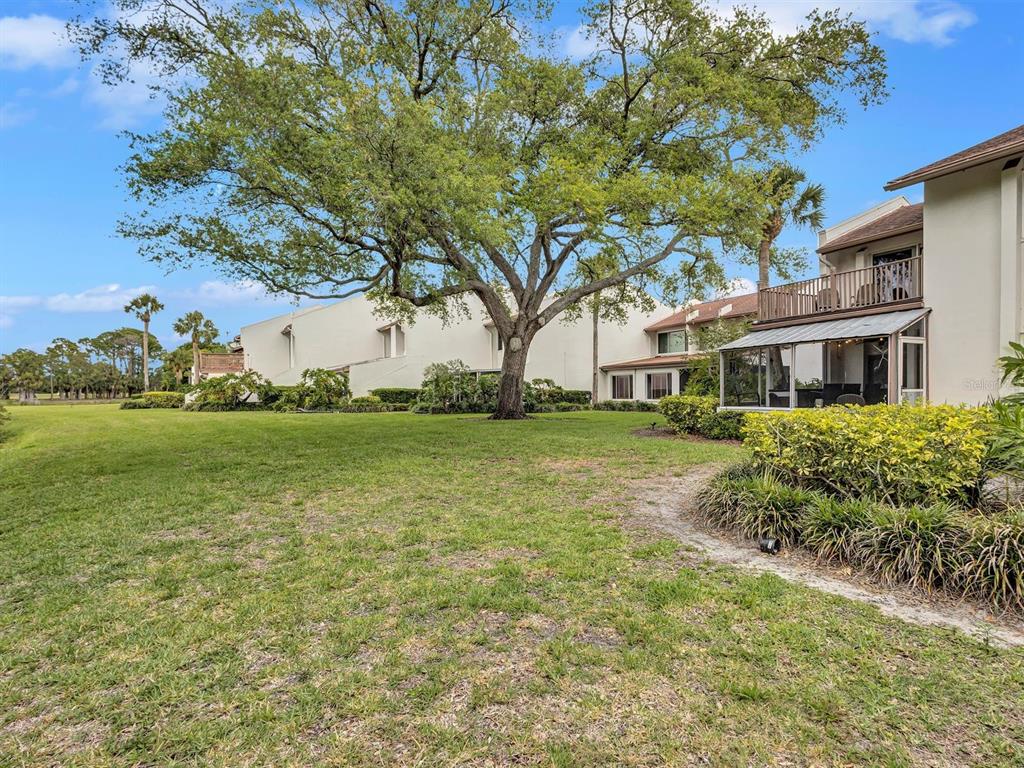 7581 Cumberland Road, Unit 7 Seminole, FL 33777 - Photo 68 of 68 a front view of a house with garden