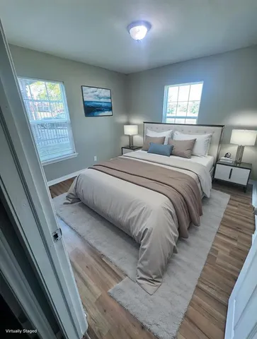 a bedroom with double bed and a window