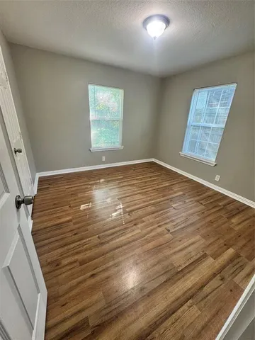 a white bath tub sitting next to a shower